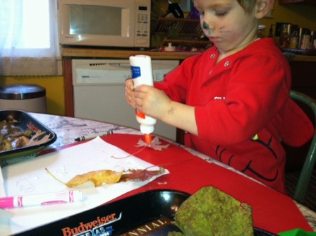 Red as small dog creating wonderful leaf artwork!